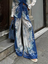 Pantalones anchos con bolsillos elásticos y estampado étnico único